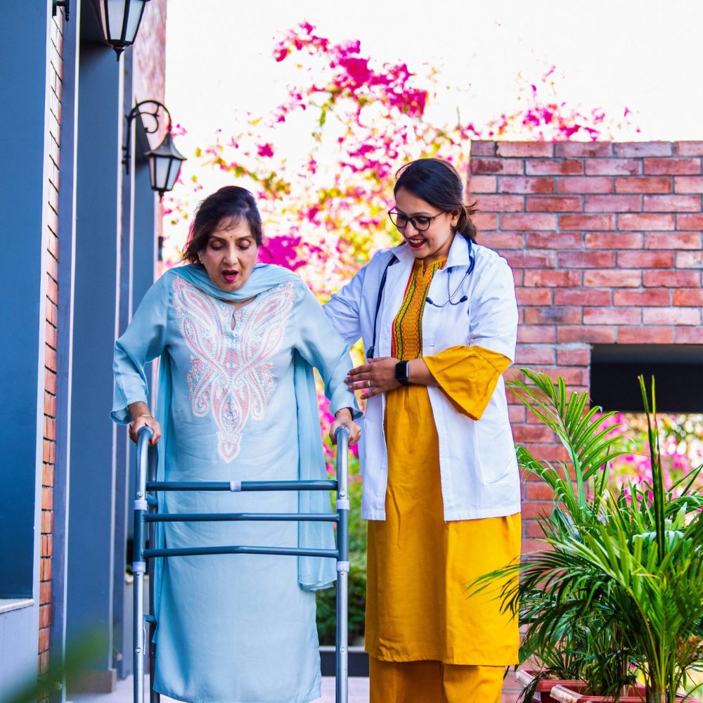 young-indian-doctor-helping-elderly-woman-patient-2026-01-08-08-11-18-utc